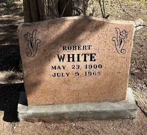 Pink-granite slant headstone — after restoration