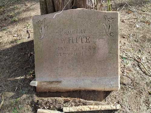 Pink-granite slant headstone — before restoration
